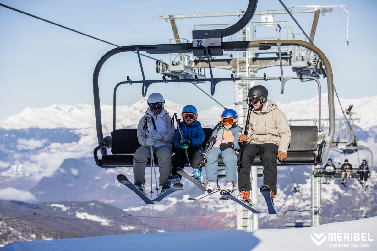 Family on ski lift in Meribel