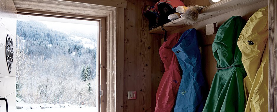 ski jackets hanging in ski chalet hallway