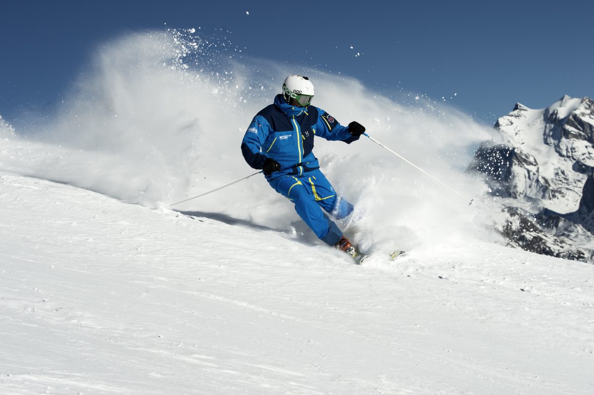 skier wearing blue ski gear